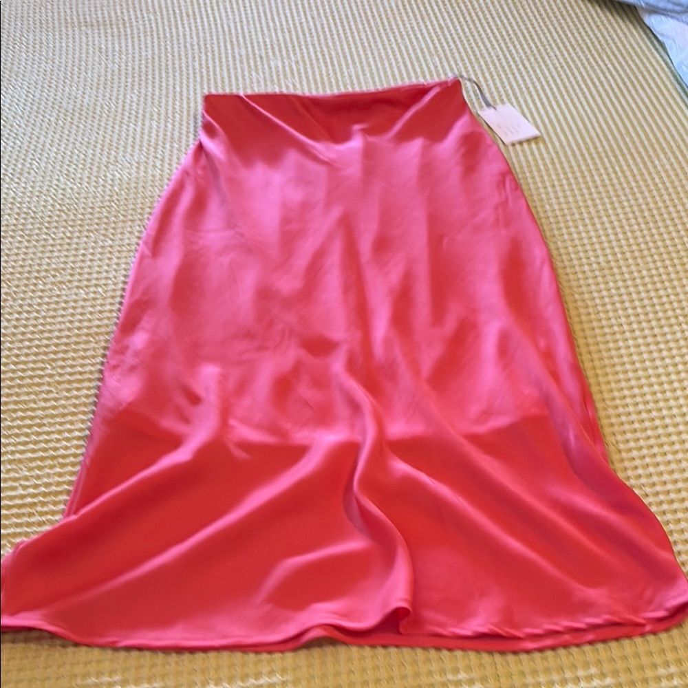 Silky, pink skirt.